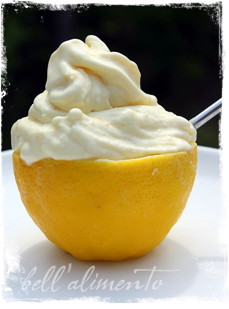 lemon gelato in a lemon with spoon.