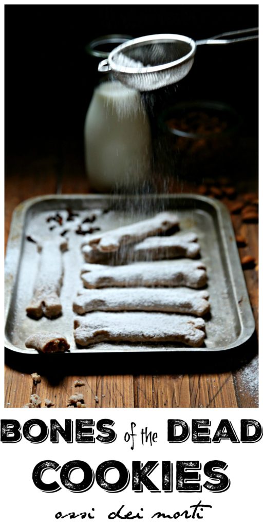 Bones of the Dead cookies on baking sheet with powdered sugar in sieve above