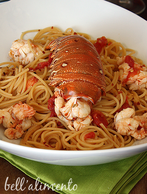 lobster medallions with pasta in white bowl. 