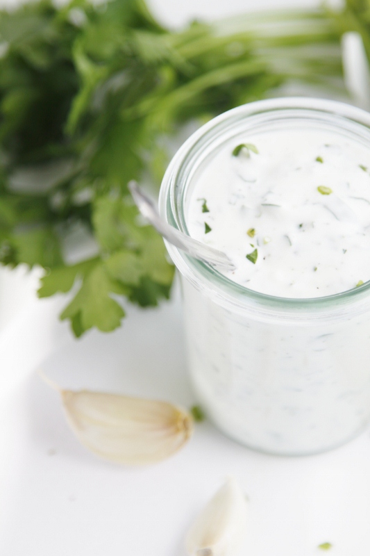 small glass jar of homemade ranch dressing.