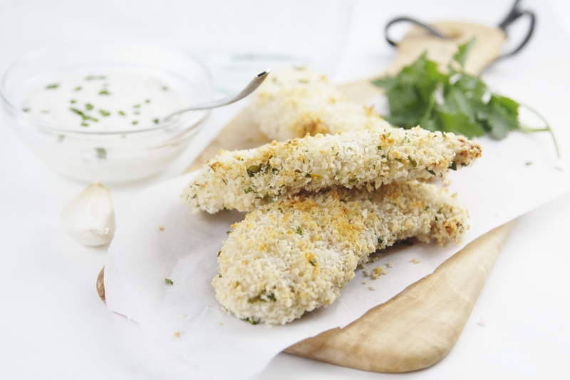 chicken tenders with ranch dressing to side.