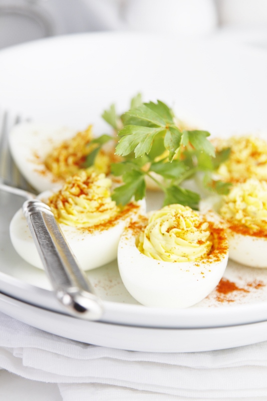 Classic Deviled Eggs on plate garnished with parsley