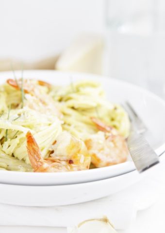 Grilled Shrimp and Avocado Pasta in white bowl with fork