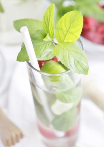 close up of a Moscato Mojito in a tall glass with straw.