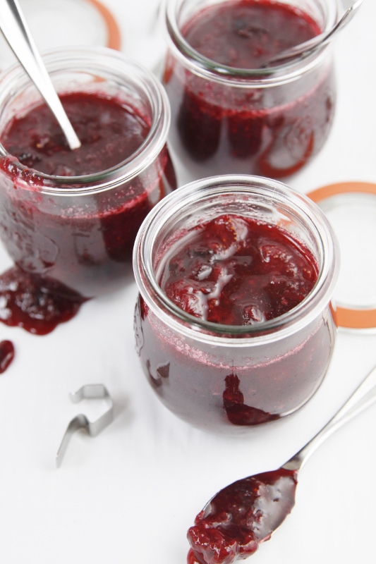 3 glass jars of small batch berry jam with spoons.