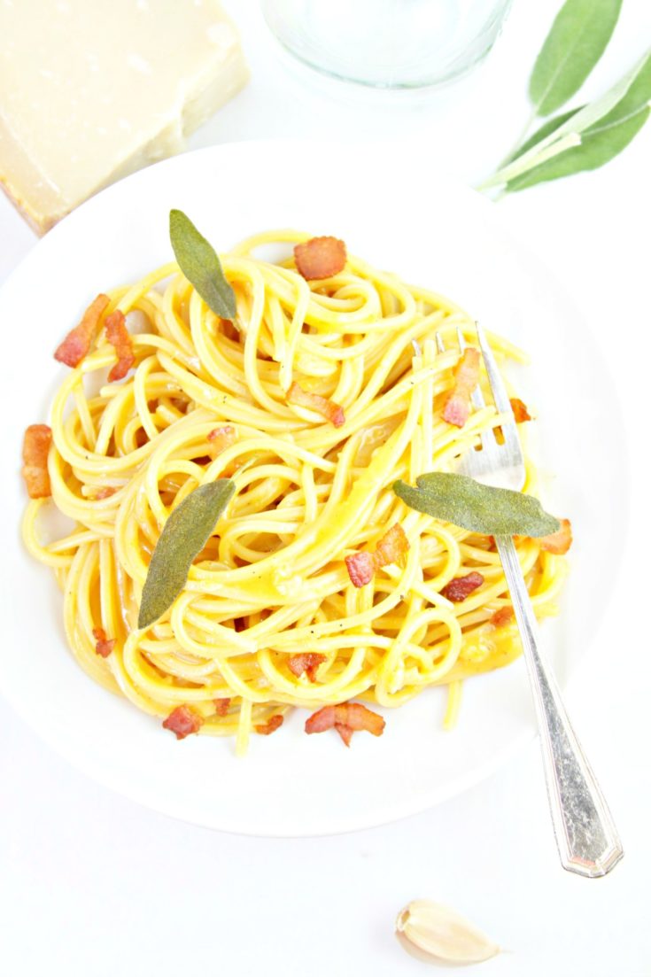 squash carbonara in white bowl with fork