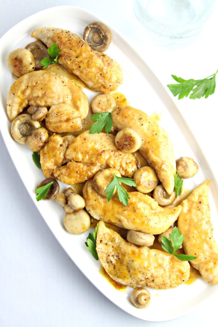 white platter with chicken and mushrooms