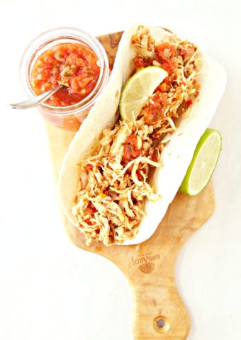 chicken tacos with jar of salsa