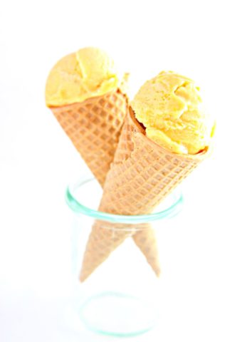 2 mango ice cream cones in small glass jar.