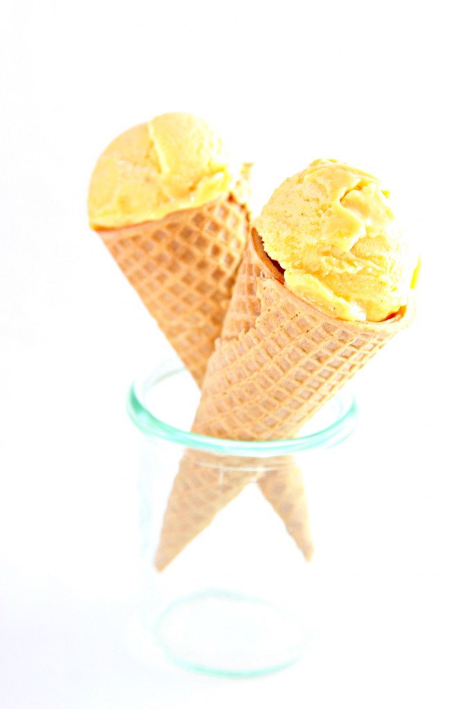 2 Mango Lime Chili Ice Cream cones standing in a small glass jar.