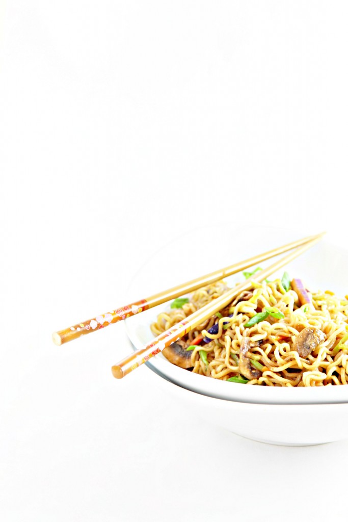 White bowl of Vegetable Ramen Noodles. Chopsticks to side. 