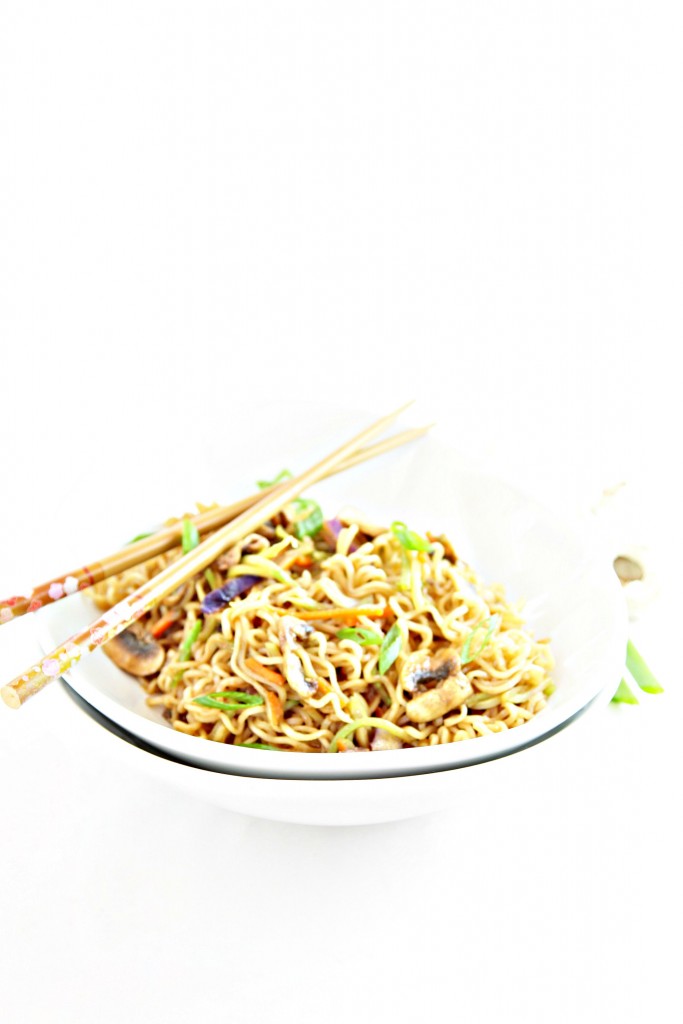 White bowl of Vegetable Ramen Noodles. Chopsticks to side. 