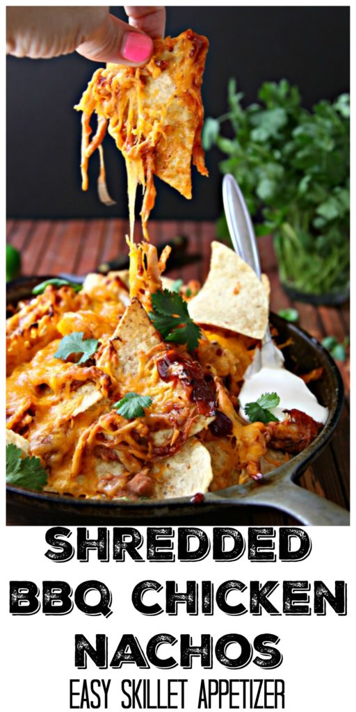 Pinterest Image. Hand pulling nacho out of skillet filled with shredded bbq chicken nachos. Text overlay reads Shredded BBQ Chicken Nachos easy skillet appetizer. 