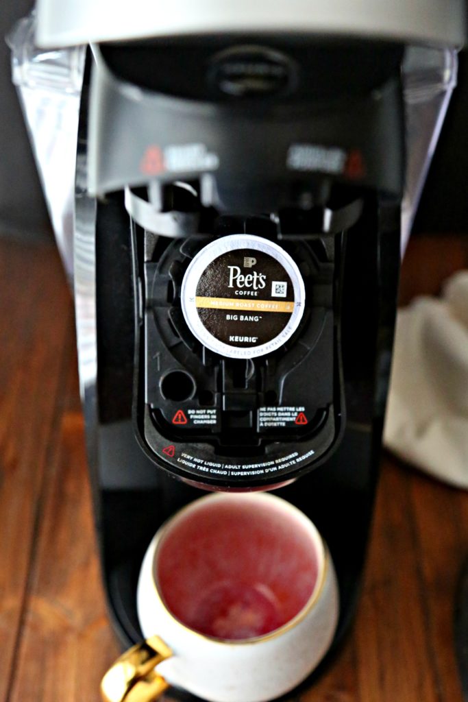 Keurig Machine with Peet's Coffee K-cup pod and coffee mug