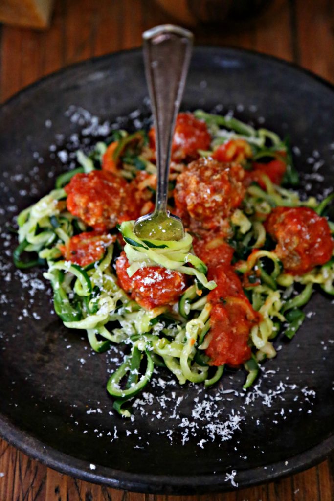 Zucchini Noodles and Meatballs on a brown plate with fork 