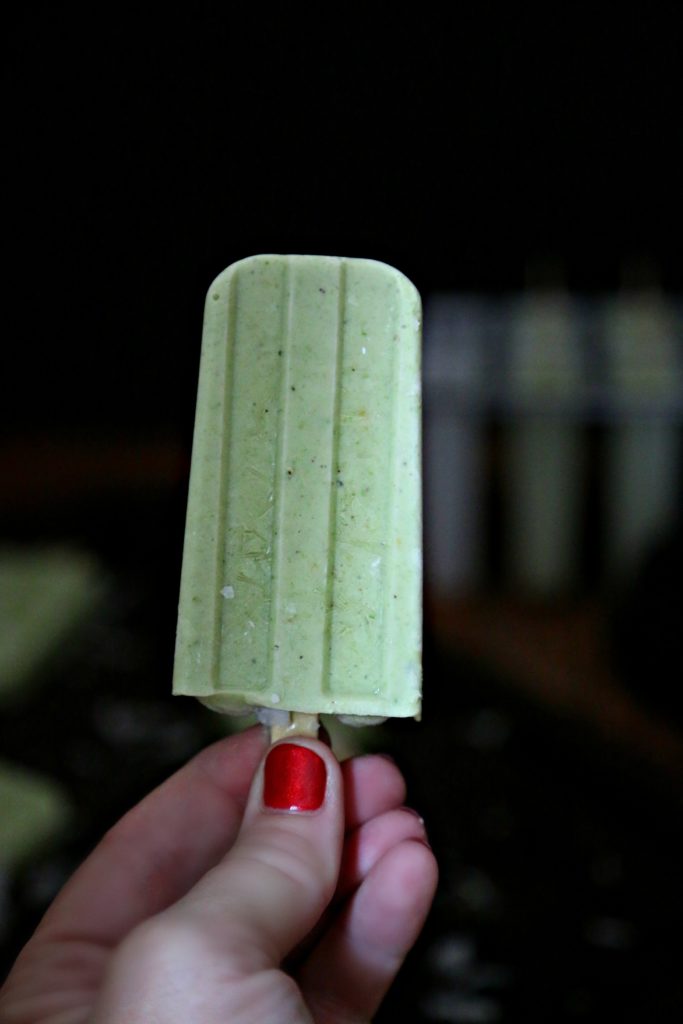 Hand holiday a Boozy Smoothie Popsicles