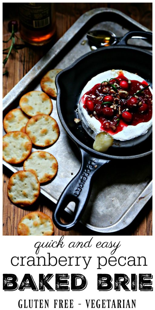 Cranberry Pecan Baked Brie in skillet surrounded by crackers