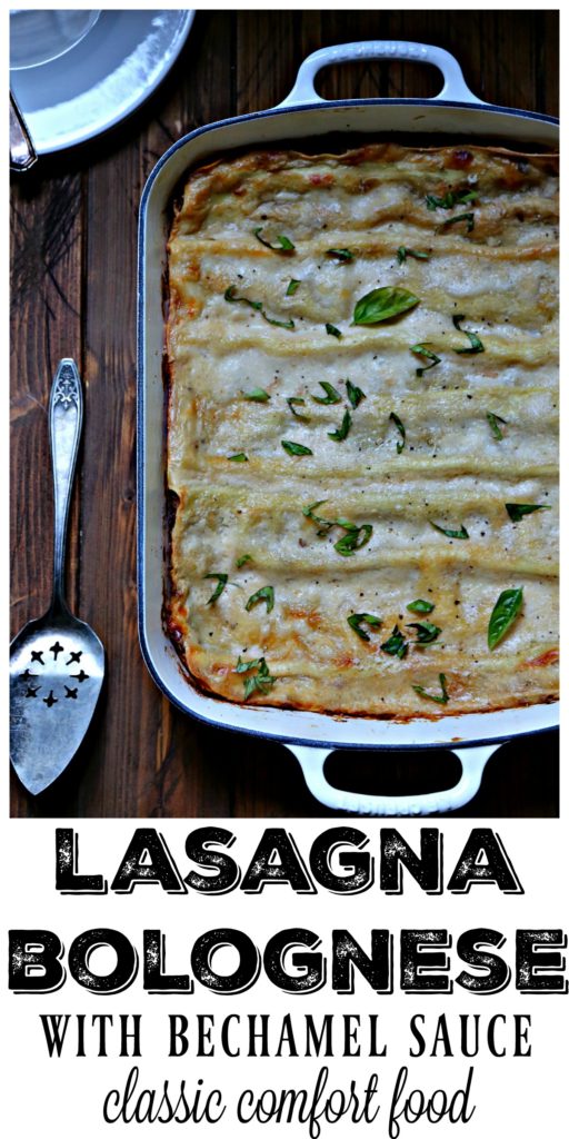 lasagna in white baking dish with serving utensil.