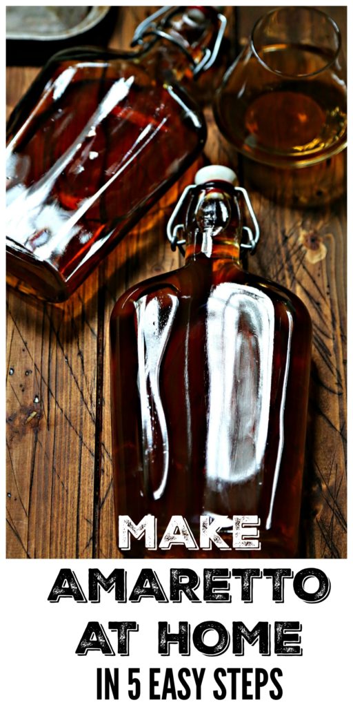 Glass Bottle with stopper of homemade amaretto with small white bowl of brown sugar in background pinterest image via Bell'Alimento