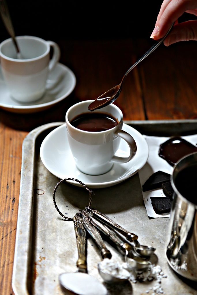 Italian hot chocolate on silver tray with spoon