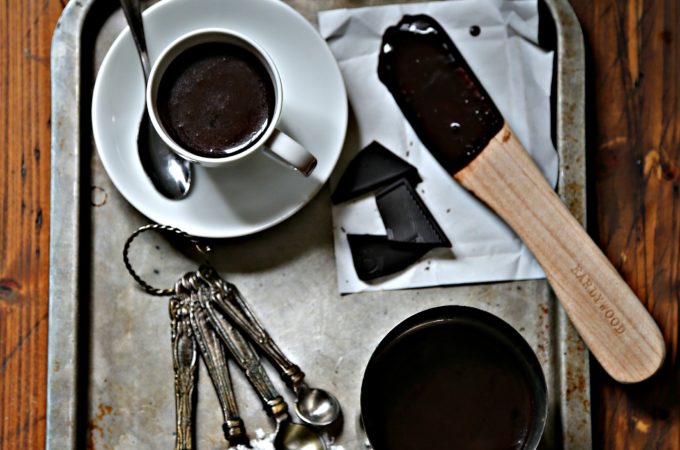 Italian hot chocolate on silver tray with spoon and ingredients via bell'alimento