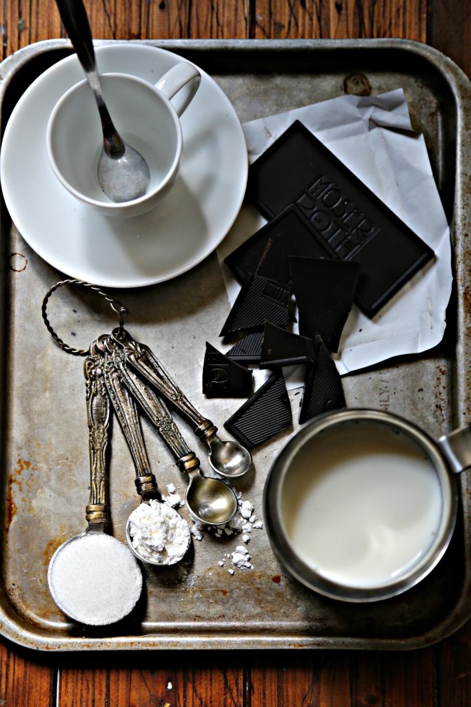 italian hot chocolate on silver tray with spoon and ingredients via bell'alimento