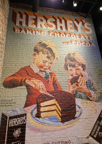 mural of 2 children frosting, eating cake at Hershey